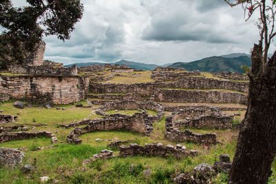 View of old ruins against cloudy sky