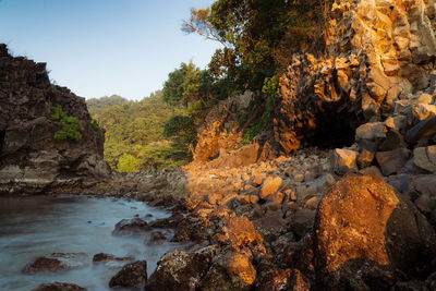 Scenic view of stream flowing through rocks