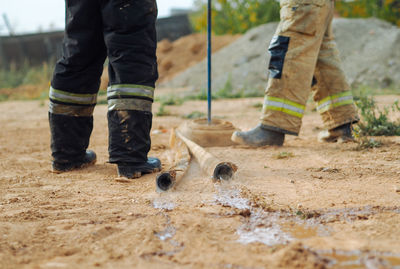 Unique job, fireman. firehose on a ground
