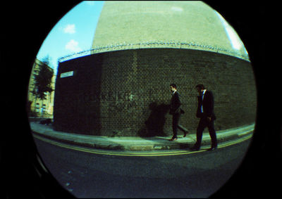 Men walking in city