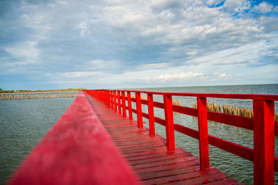Pier over sea against sky