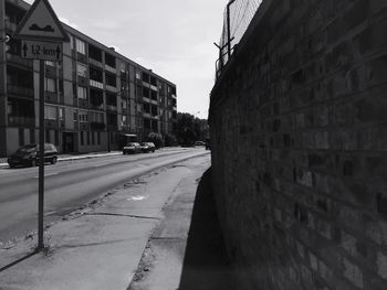 Vehicles on road along buildings