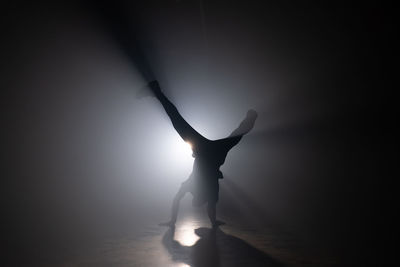 Silhouette woman dancing on stage