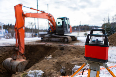 Traffic cone at construction site against sky