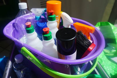 High angle view of cleaning equipment in bucket