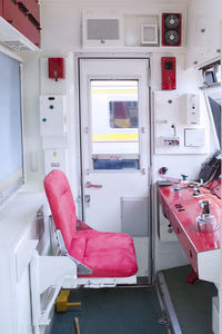 Empty seats in front of dashboard of locomotive