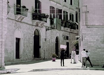 Woman standing in front of historic building