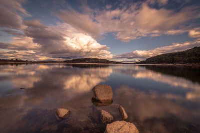 Scenic view of lake against sky during sunset