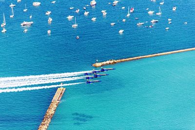Sailboat in calm blue sea