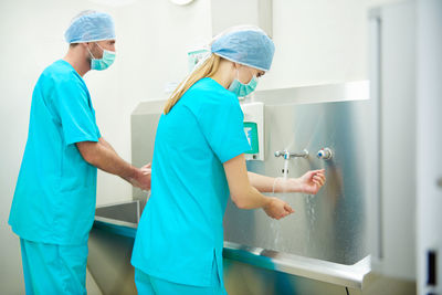 Surgeons washing hands