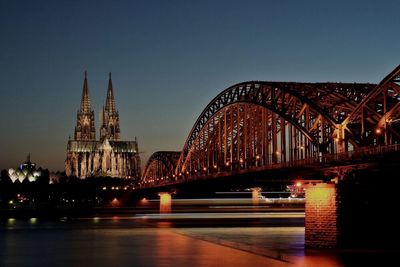 Bridge over river at night