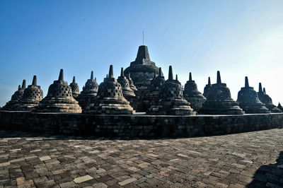 Stupas of building against clear sky