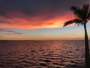 Scenic view of sea against romantic sky at sunset