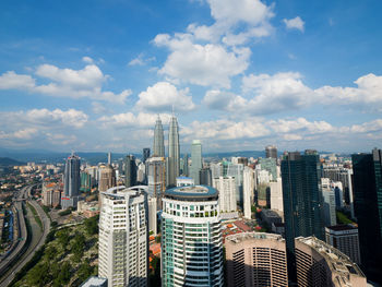 Aerial view of cityscape against sky