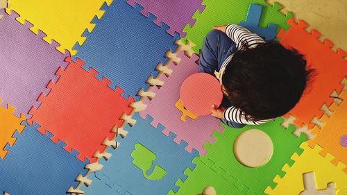 Full length rear view of man painting