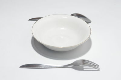High angle view of empty coffee on table against white background