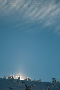Panoramic view of snowcapped mountains against sky