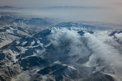 Scenic view of snowcapped mountains against sky