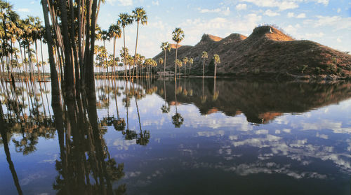 Panoramic view of lake and buildings against sky