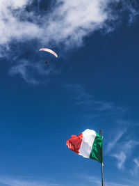 Low angle view of kite flying against sky