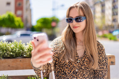 Young woman using mobile phone
