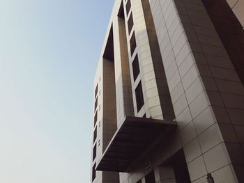 Low angle view of modern building against clear sky