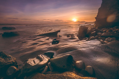 View of beach at sunset