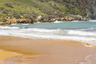 Scenic view of beach against sky