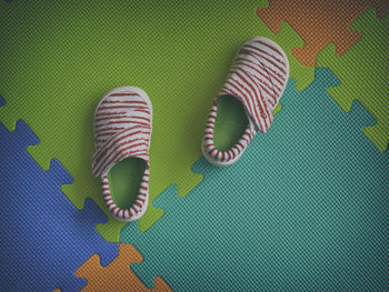 High angle view of shoes on colorful floor