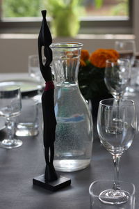 Close-up of wine glasses on table