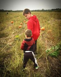 Boy playing in field
