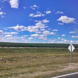 Scenic view of landscape against cloudy sky