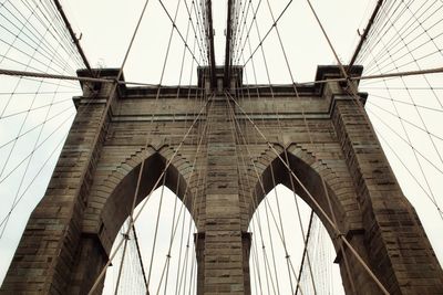 Low angle view of brooklyn bridge against sky