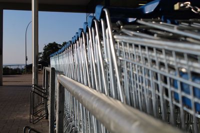 Close-up of railing against sky
