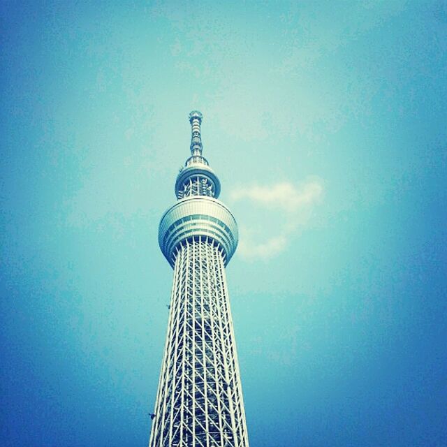 low angle view, tower, architecture, built structure, tall - high, blue, communications tower, famous place, building exterior, clear sky, international landmark, capital cities, travel destinations, tourism, copy space, travel, communication, sky, spire, modern