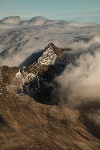 Aerial view of alpine landscape coverd with clouds