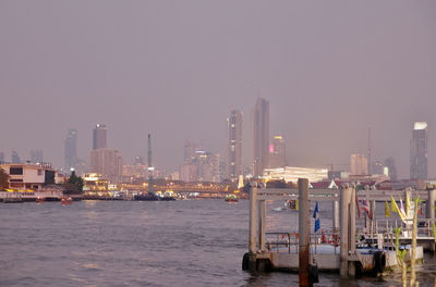 Scenic view of city by buildings against sky