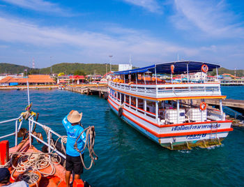 High angle view of boats moored in sea against sky