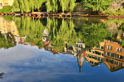 High angle view of lake by buildings against sky