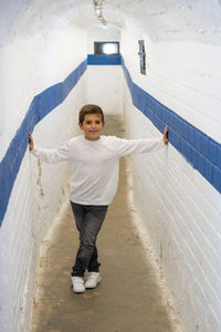 Portrait of a little kid on a underground passage