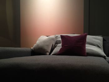 Cushions on sofa against wall