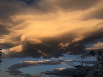 Low angle view of clouds in sky during sunset