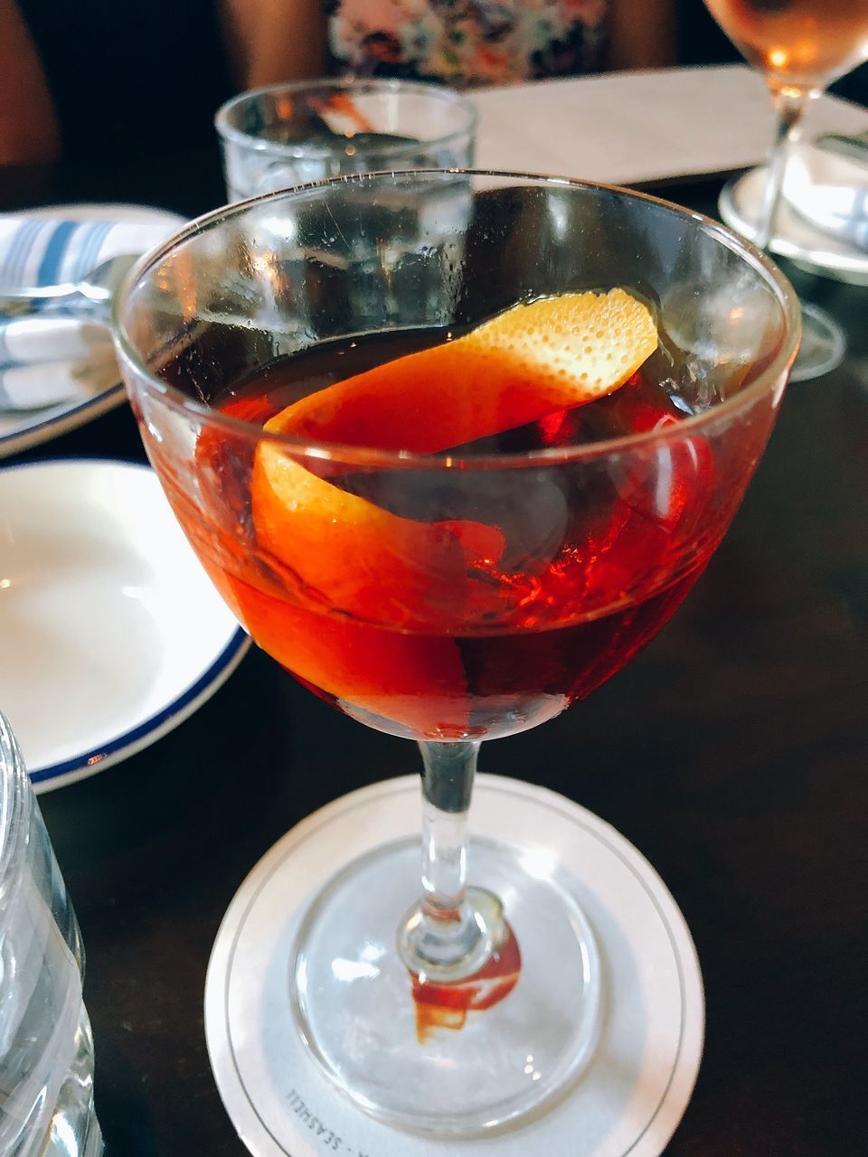 CLOSE-UP OF WINEGLASS ON TABLE