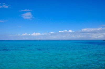 Scenic view of sea against blue sky