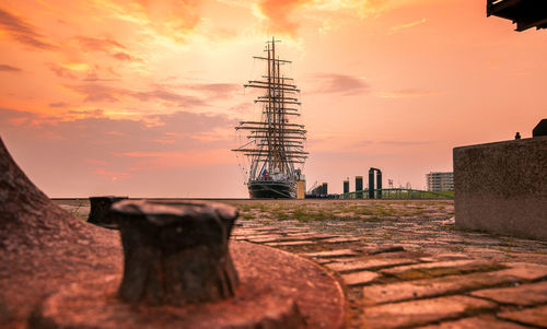 Low angle view of tower against sky during sunset