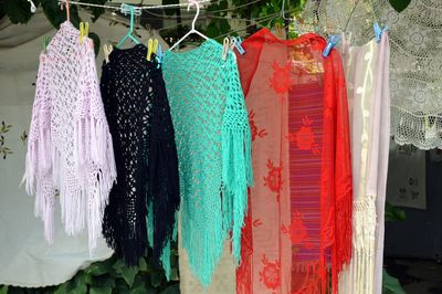 Close-up of multi colored clothes hanging on clothesline