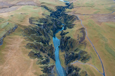 Wide estuary between hills in iceland, winding blue river, stream. tourist picturesque landscape.