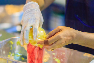 Close-up of hand holding ice cream