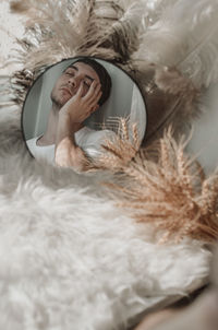 Portrait of young man in mirror