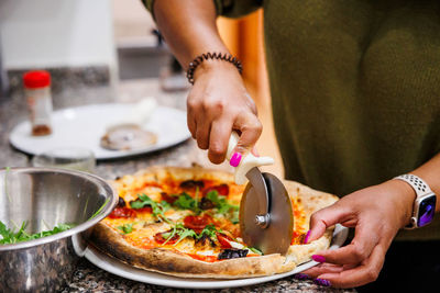 Midsection of man preparing food